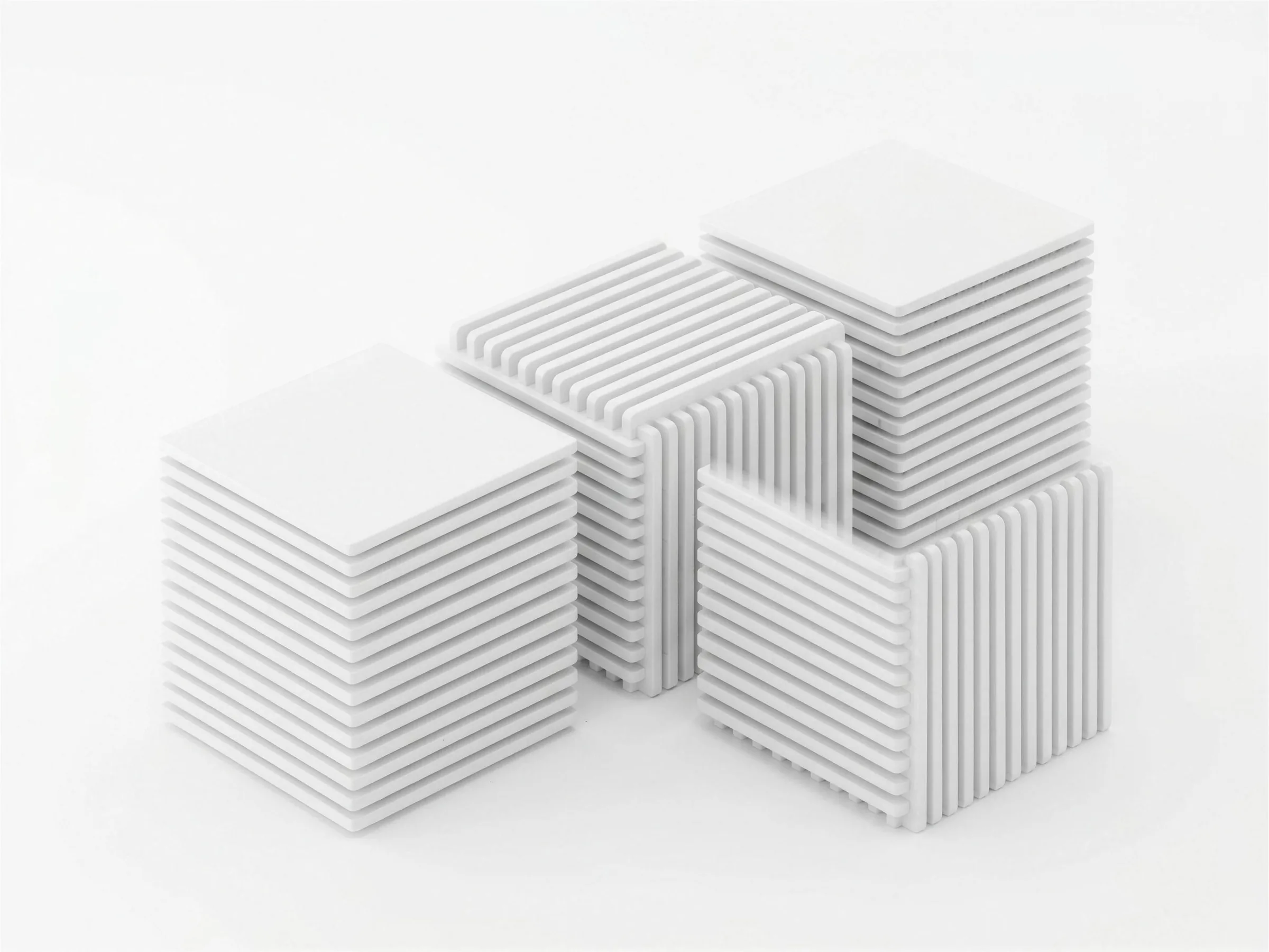 Three cubic modules built from stacked white plates, connected in a row