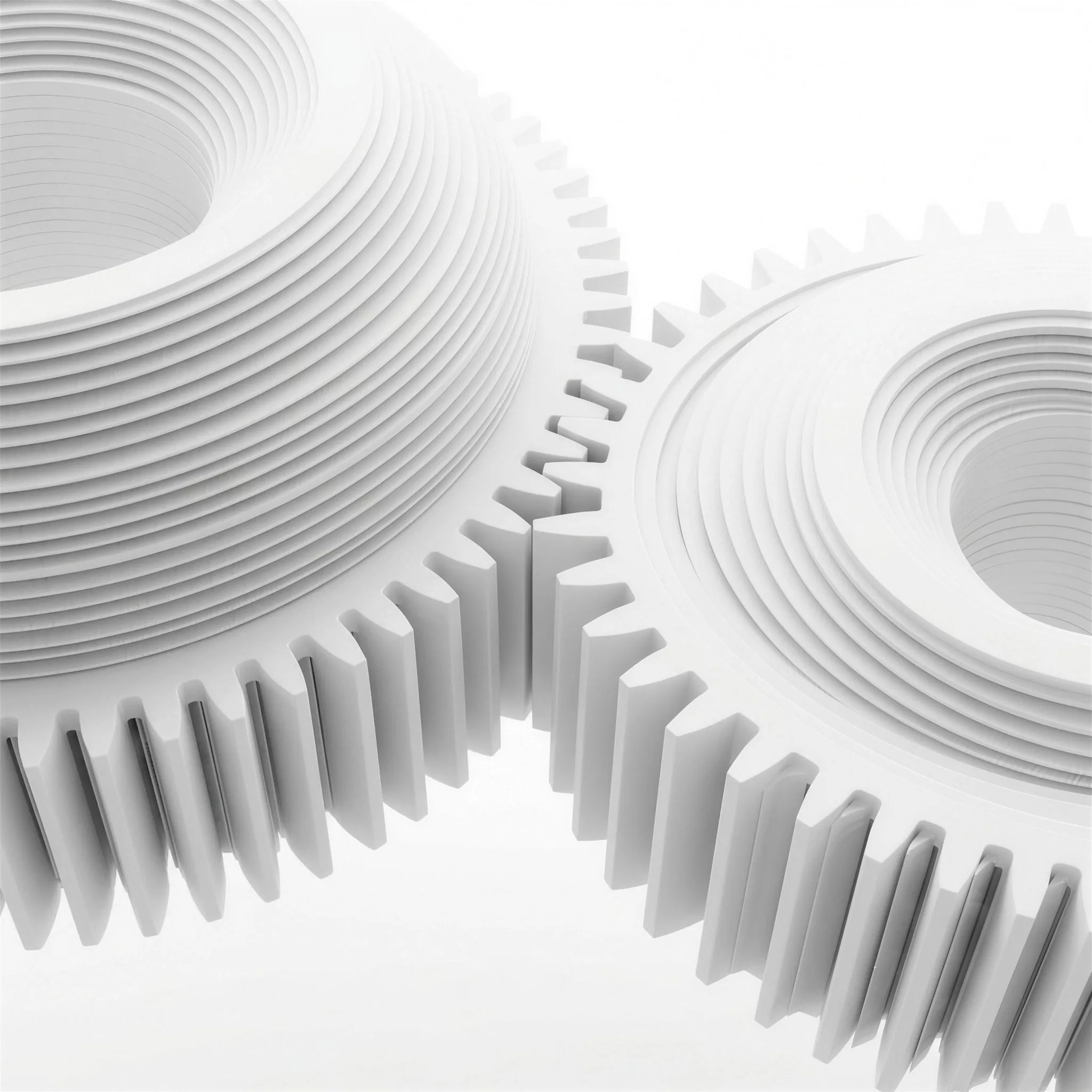 Two interlocking gear forms built from stacked white plates